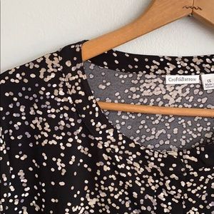 Blouse buttons half way up the front